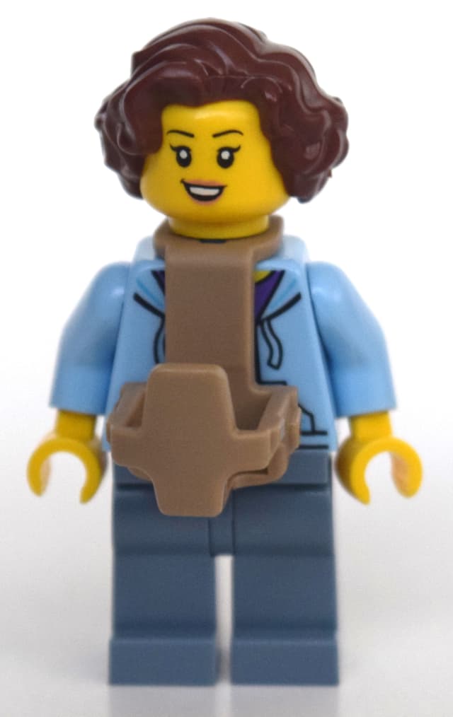 Woman, Open Jacket over Purple Shirt, Sand Blue Legs, Baby Carrier, Reddish Brown Hair